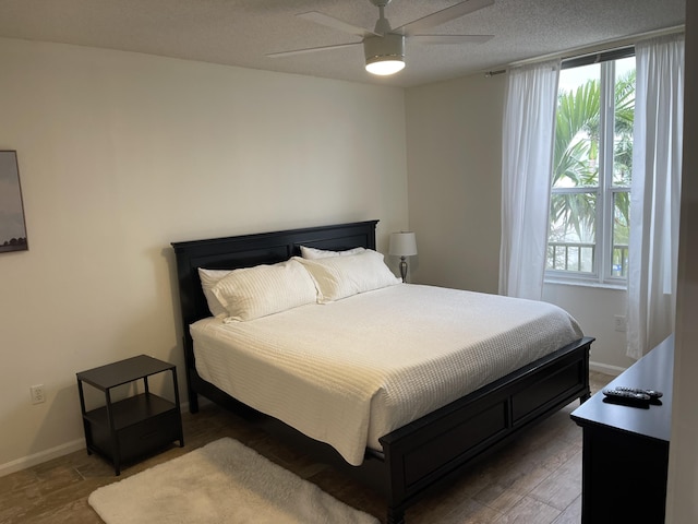 bedroom featuring hardwood / wood-style floors and ceiling fan