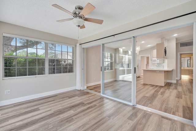 unfurnished sunroom featuring ceiling fan and lofted ceiling