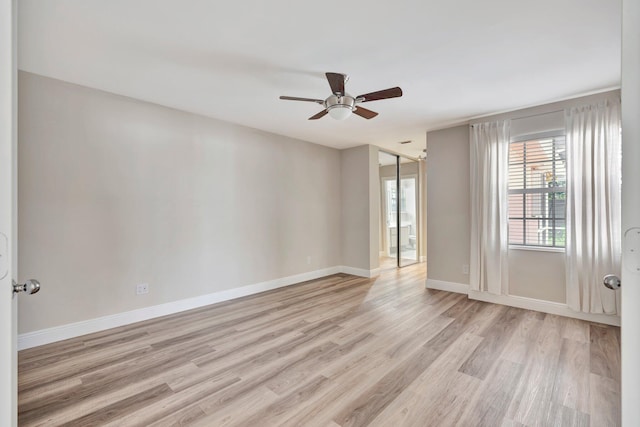 empty room with light hardwood / wood-style flooring and ceiling fan