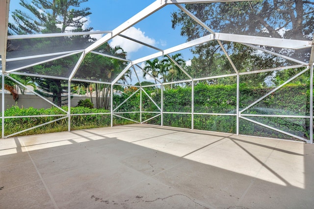 view of patio / terrace featuring glass enclosure