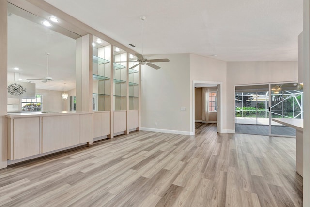 spare room featuring ceiling fan and light hardwood / wood-style flooring