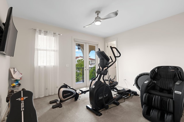 exercise area featuring carpet, ceiling fan, plenty of natural light, and french doors