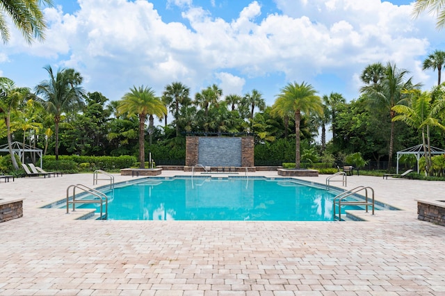 view of pool with a gazebo and a patio