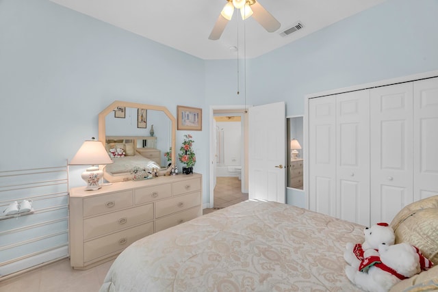 tiled bedroom featuring a closet and ceiling fan