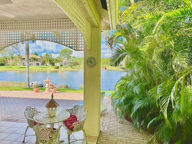 view of patio with a water view