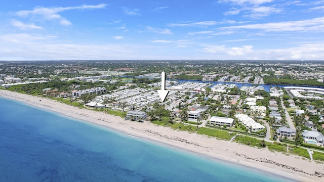 bird's eye view featuring a water view and a beach view