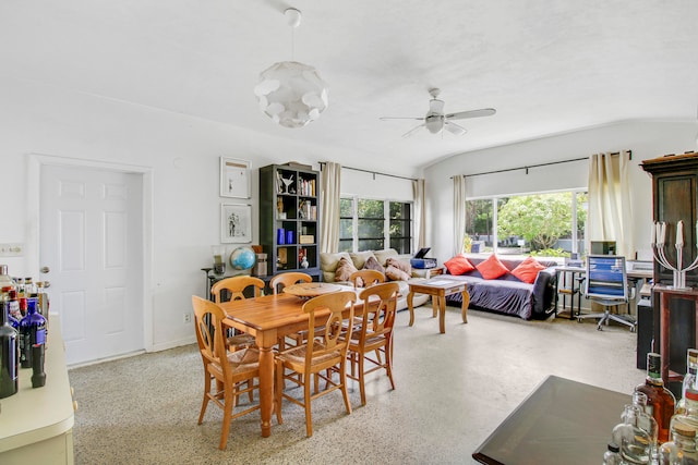 dining area with ceiling fan and lofted ceiling