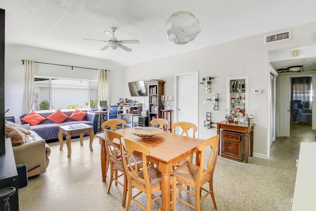 dining space featuring ceiling fan and vaulted ceiling