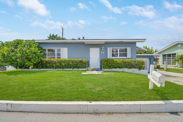 view of front of home featuring a front lawn