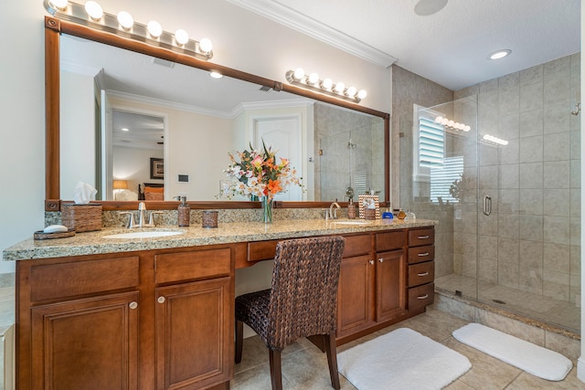 bathroom with ornamental molding, a shower with shower door, tile patterned floors, and dual vanity