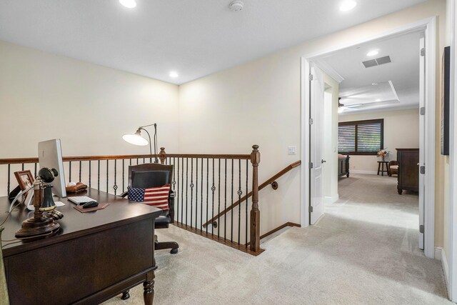 carpeted office featuring ceiling fan