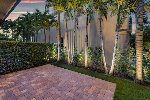 view of patio terrace at dusk