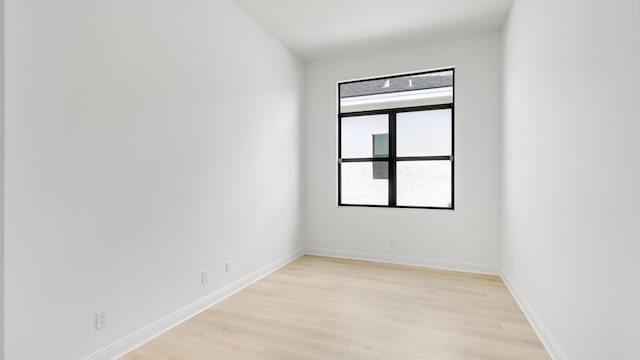 unfurnished room with light hardwood / wood-style floors