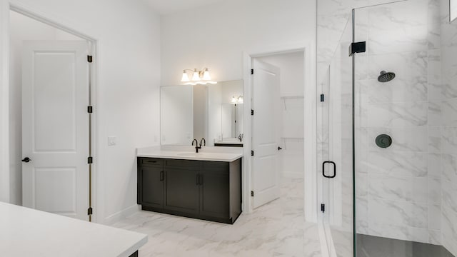 bathroom with vanity and a shower with door