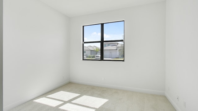 empty room with light colored carpet