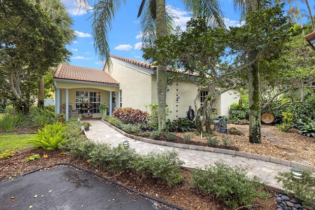 mediterranean / spanish-style house featuring french doors