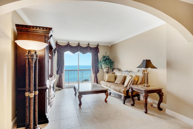 living room featuring light tile patterned floors, a water view, and crown molding