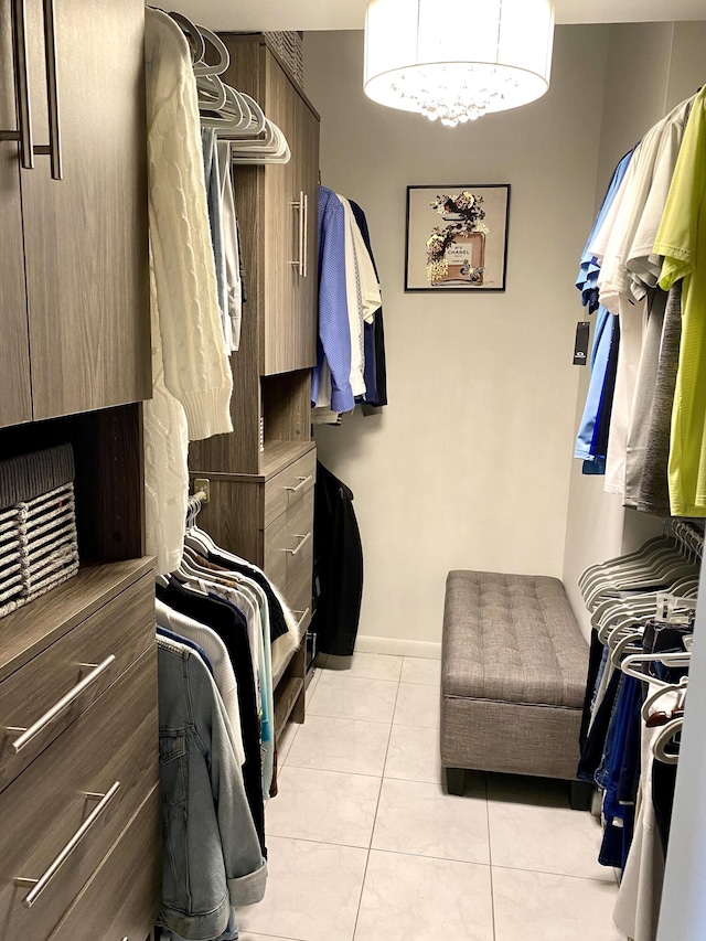 spacious closet with light tile patterned floors