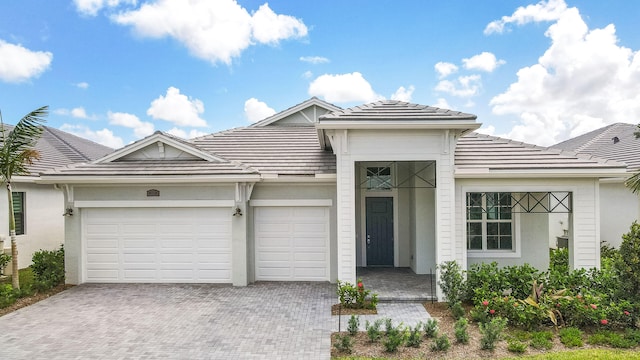 view of front of property with a garage