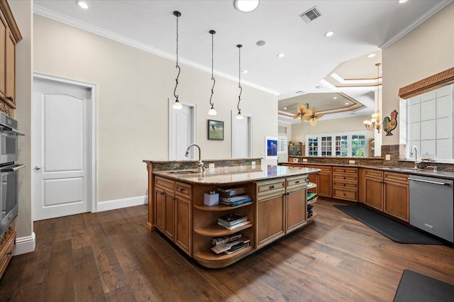 kitchen with dishwasher, sink, hanging light fixtures, crown molding, and a center island with sink