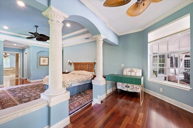 bedroom with ceiling fan, ornate columns, ornamental molding, and multiple windows