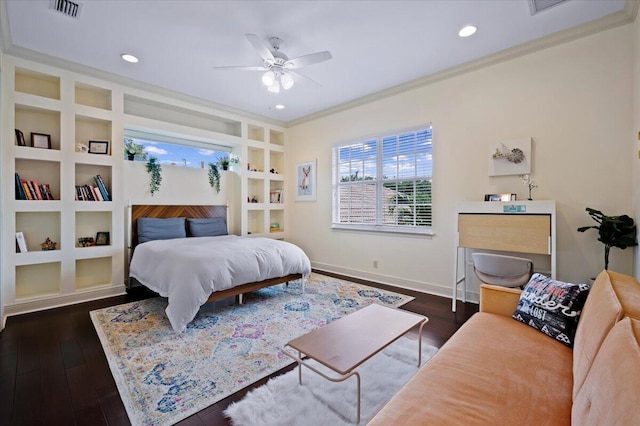 bedroom with ceiling fan, ornamental molding, and dark wood-type flooring