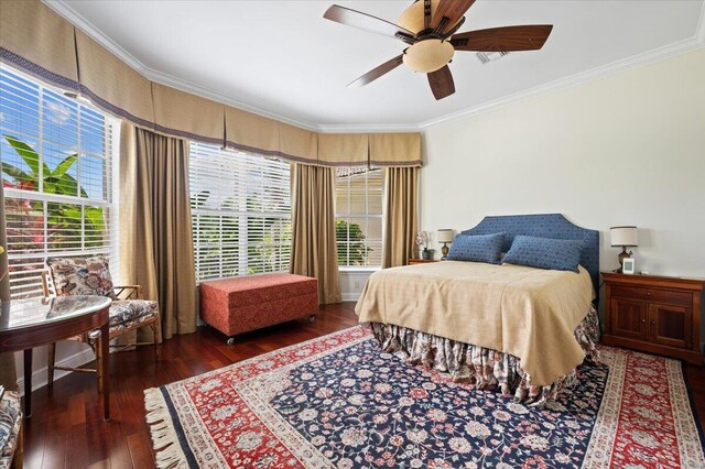 bedroom with ceiling fan, dark wood-type flooring, and ornamental molding