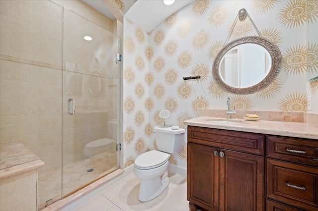 bathroom with tile patterned flooring, vanity, toilet, and a shower with door