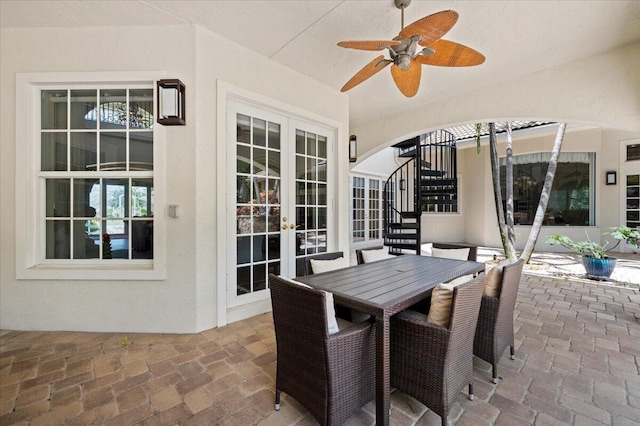 view of patio / terrace featuring ceiling fan and french doors