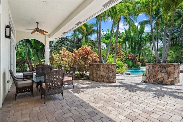 view of patio featuring ceiling fan