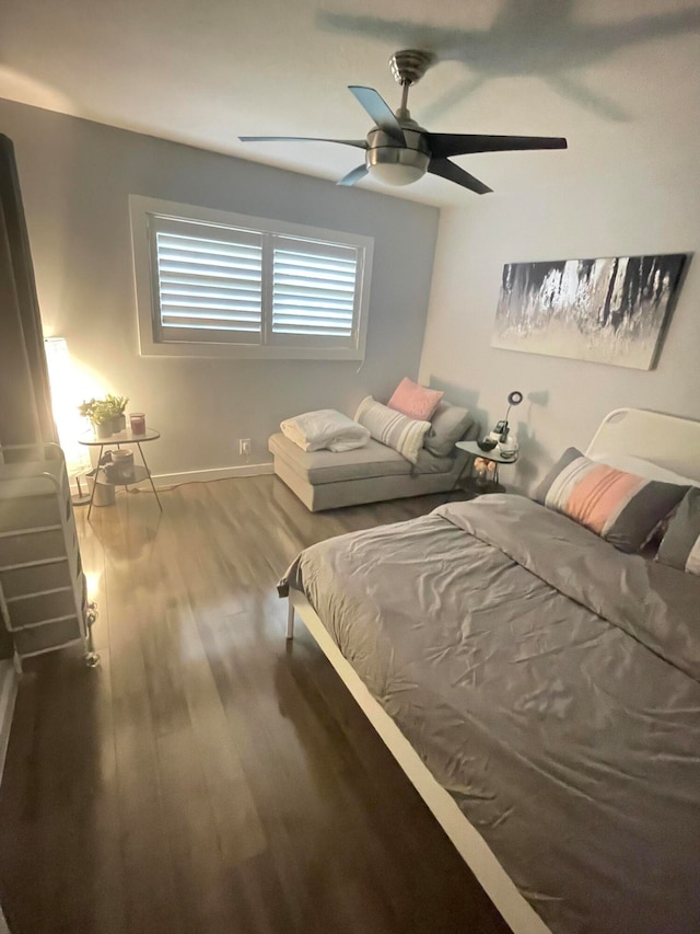 bedroom with ceiling fan and hardwood / wood-style floors