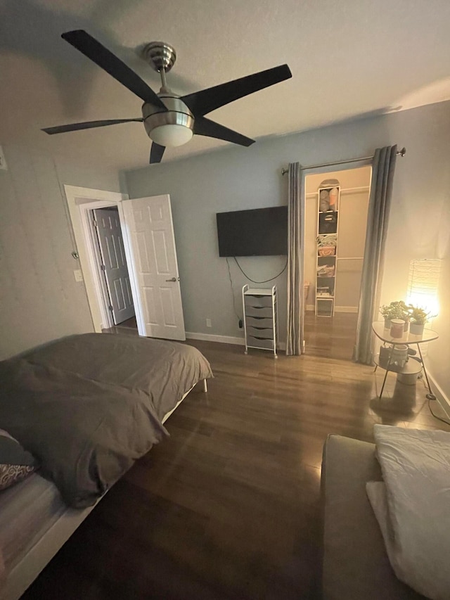 bedroom featuring hardwood / wood-style floors and ceiling fan