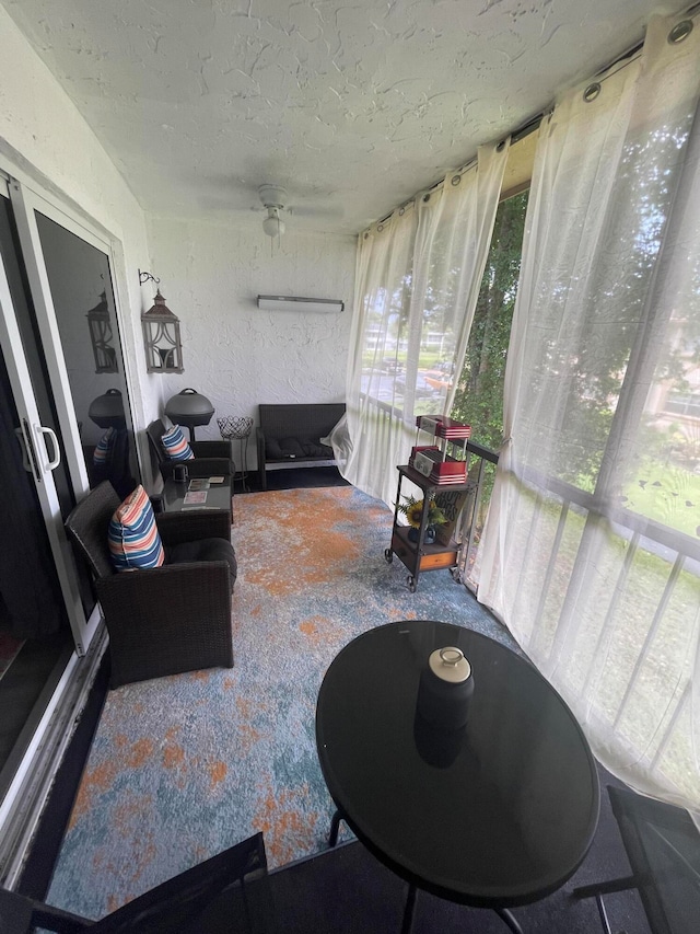 sunroom / solarium with ceiling fan