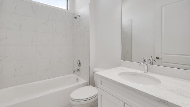 full bathroom featuring toilet, vanity, and tiled shower / bath