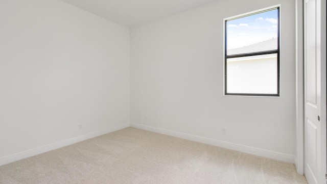 empty room featuring light colored carpet