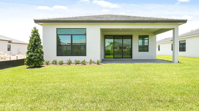 back of house featuring a yard