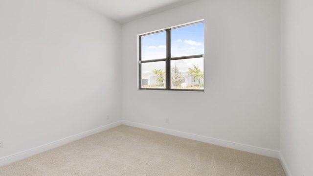 unfurnished room featuring carpet floors