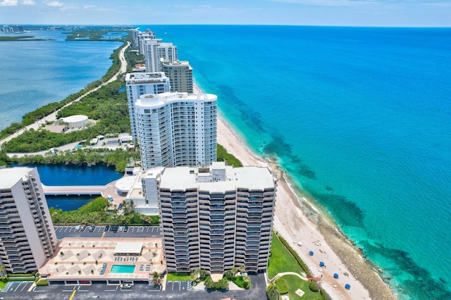 aerial view featuring a beach view, a water view, and a city view