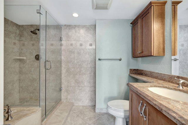 bathroom featuring toilet, an enclosed shower, tile patterned floors, and vanity