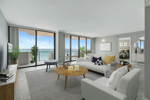 tiled living room featuring a water view and expansive windows