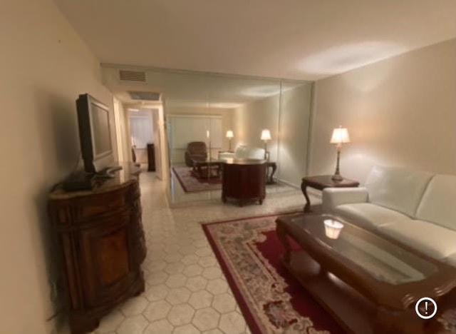 living room with light tile patterned floors