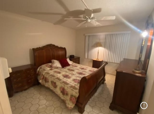 tiled bedroom with ceiling fan