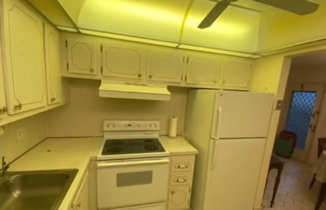 kitchen with sink, ceiling fan, white appliances, and white cabinetry