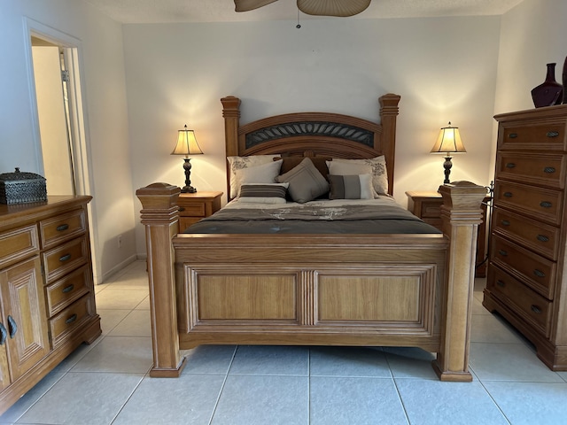 tiled bedroom featuring ceiling fan