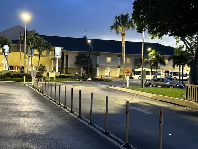 view of outdoor building at dusk