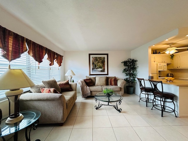 living room with light tile patterned floors and ceiling fan