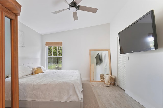 bedroom with lofted ceiling, wood-type flooring, and ceiling fan