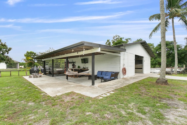 exterior space featuring a patio area, an outdoor hangout area, and a yard