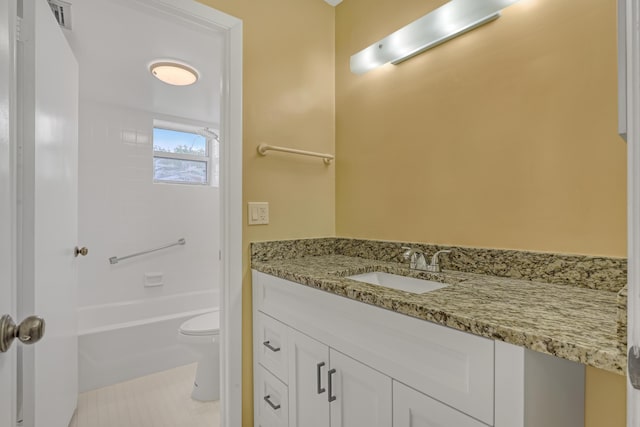 bathroom with tile patterned flooring, vanity, and toilet