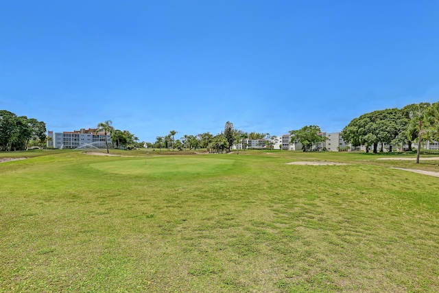 view of home's community with a lawn